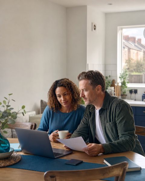 A couple reviewing their home energy options together